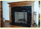 A Picture of a large marble fireplace